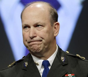 In this Oct. 21, 2013 photo, Chief of Police Michael Kehoe, of Newtown, Conn., listens as he is acknowledged during IACP.