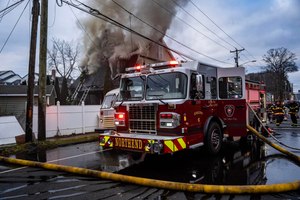 Firefighters saw heavy flames coming from the side porch of the wood frame home as the fire rapidly spread, according to Meriden Deputy Fire Chief Ryan Dunn. Dunn said witnesses broke down a back door and were pulling people to safety. They told firefighters that someone was trapped.