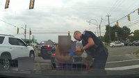 Watch: Mich. officer saves child in middle of traffic