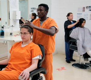 Immigration detainees using a beauty salon that has been set up at a dedicated unit for transgender women in the Cibola County Correctional Center in Milan, N.M.