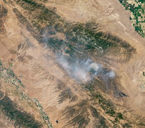 Officials said the Mineral Fire in Fresno County, Calif. was nearly contained Thursday after burning nearly 30,000 acres. (Photo/Lauren Dauphin, NASA Earth Observatory)