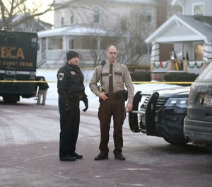 Law enforcement officers were at the scene Tuesday morning after Officer Arik Matson was 'severely wounded' in a shooting Monday night when responding to a domestic disturbance call. (Photo/TNS)