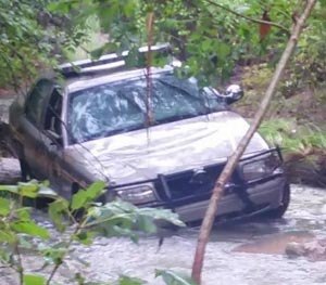 The deputy's empty patrol car found in floodwaters.