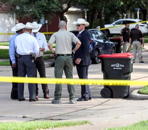 Authorities investigate the scene where a Fort Bend County Deputy Sheriff fatally shot a Fort Bend County Precinct 4 Deputy Constable after mistaking him for an intruder as they cleared a house, Friday, May 29, 2020, in Missouri City, Texas. (Photo/AP)