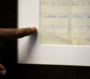 Jefferson County Sheriff Mark Pettway points out an old jail log showing the name of Dr. Martin Luther King Jr. in Birmingham, Ala. (Photo/AP)