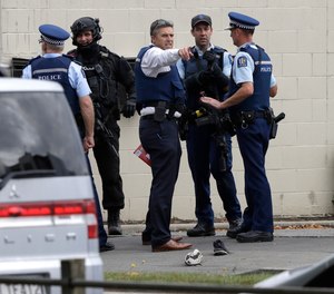 Police stand outside a mosque in central Christchurch, New Zealand, Friday, March 15, 2019. Multiple people were killed in mass shootings at two mosques full of people attending Friday prayers, as New Zealand police warned people to stay indoors as they tried to determine if more than one gunman was involved.