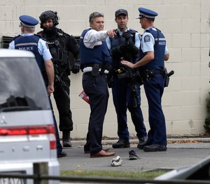 Police stand outside a mosque in central Christchurch, New Zealand, Friday, March 15, 2019. Multiple people were killed in mass shootings at two mosques full of people attending Friday prayers, as New Zealand police warned people to stay indoors as they tried to determine if more than one gunman was involved.