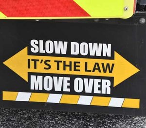 The state law that requires motorists to change lanes to avoid emergency vehicles is expanding to cover any stopped vehicle showing warning signals.
