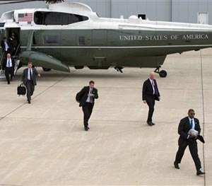 Secret Service agents arrive at Gary/Chicago International Airport ahead of the arrival of President Barack Obama, on Thursday, Oct. 2, 2014, in Gary, Ind. (AP Image)