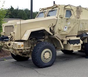 In this July 16, 2014 file photo, a Mine-Resistant Ambush Protected vehicle sits in front of police headquarters in Watertown, Conn. The L.A. Unified's School District police department received a MRAP vehicle like this one through a federal program. (AP Image)