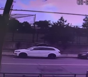 Surveillance footage shows the attackers run up on the officer, who was off-duty and jogging at the time.