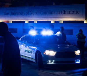Police secure the main entrance to UNC Charlotte after a fatal shooting at the school, Tuesday, April 30, 2019, in Charlotte, N.C.