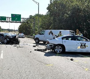 This photo provided by the Indiana State Police shows the aftermath of a crash along Interstate 865 near Zionsville, Ind., Wednesday, Aug. 30, 2017.