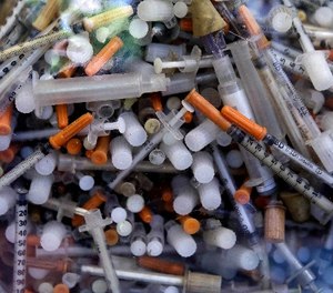 This Wednesday June 7, 2017 photo shows hypodermic needles that were recovered from the Merrimack River in 2016, at the Clean River Facility facility in Methuen, Mass.