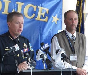Sparks Police Chief Brian Allen, left, addresses reporters while Washoe County School District Police Chief Mike Mieras looks on Tuesday, May 13, 2014 at a news conference announcing the findings of a six-month investigation into a deadly shooting rampage at Sparks Middle School in October in Sparks, Nev.