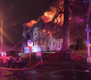 A three-alarm fire in Elizabeth, N.J., displaced 25 residents on New Year's Day. Fire officials are investigating whether fireworks ignited the blaze.