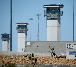 In this April 15, 2015 file photo guard towers are seen at High Desert State Prison in Indian Springs, Nev.