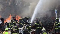 Explosion levels 2 NJ houses, injures 10 firefighters