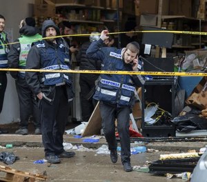 Responders work to clean up the scene of Tuesday's shooting that left multiple people dead at a kosher market on Wednesday Dec. 11, 2019, in Jersey City, N.J.