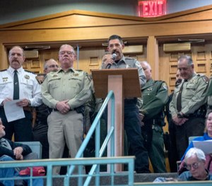 Cibola County Sheriff Tony Mace, center, flanked by several other sheriffs from around New Mexico, speaks Tuesday in opposition to a proposed red flag gun law that passed the Senate Public Affairs Committee via a party-line 4-3 vote. (Photo/TNS)