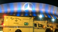 Mercedes-Benz Superdome lit blue and gold in honor of EMS Week