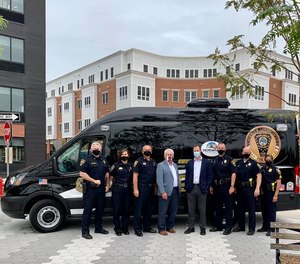 Norwalk police officers stand in front of the department's new Community Engagement Van, revealed September 17, 2020. (Photo/Norwalk Police Department)