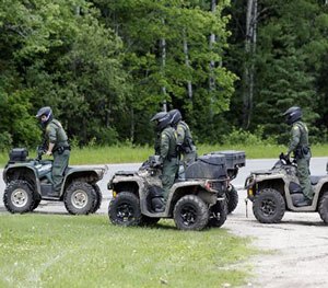 Law enforcement officers on all terrain vehicles in search for escaped prisoners in Dannemora as it continues, on Monday, June 22, 2015
