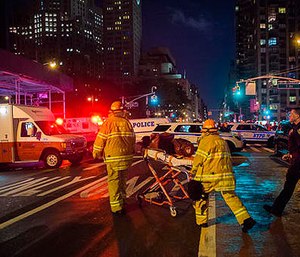 Police and firefighters work near the scene of an apparent explosion in Manhattan's Chelsea neighborhood, in New York, Saturday, Sept. 17, 2016. (AP Photo/Andres Kudacki)