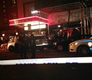 Authorities stand outside Irving Plaza, near Manhattan's Union Square in New York after a shooting Wednesday, May 25, 2016.