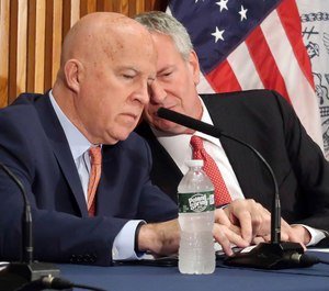New York City Police Commissioner James O'Neill, left, and Mayor Bill de Blasio confer during the monthly crime briefing at New York City Police Department headquarters, Wednesday Sept. 4, 2019. (AP Photo/Michael R. Sisak)