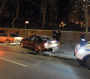 An NYPD officer's leg was fractured Tuesday night after a hit-and-run driver pinned the officer between two vehicles. (Photo/TNS)