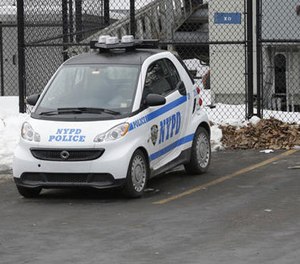 In this Feb. 12, 2015 file photo, A New York City Police Department Smart car is parked in the parking lot of Central Park's precinct in New York. (AP Photo/Mary Altaffer)