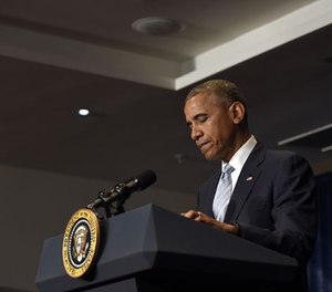 President Barack Obama pauses as he makes a statement on the fatal police shootings of two black men in Louisiana and Minnesota after arriving in Warsaw, Poland, Friday, July 8, 2016. Obama traveled to Poland to attend the NATO summit and then will travel on to Spain.