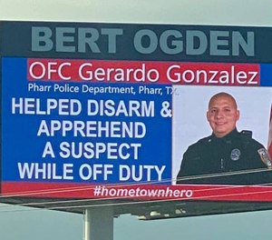 A billboard near Pharr, Texas, on September 11, 2020, honors Officer Gerard Gonzalez for going above and beyond the call of duty when he helped a police officer in another city disarm a suspect.