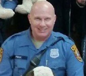 Officer Sean Peek died at home hours after attempting to rescue a suspect from a river on September 6, 2020.