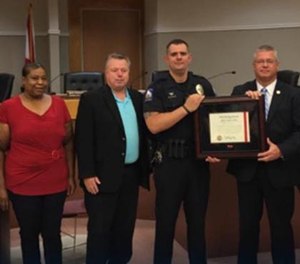 Oxford Police Officer Andrew Miller was honored by Police Chief Bill Partridge with the Life Saving Commendation. (Photo/Oxford Police Department)