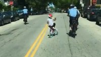 Video: Philly police officers help girl ride bike