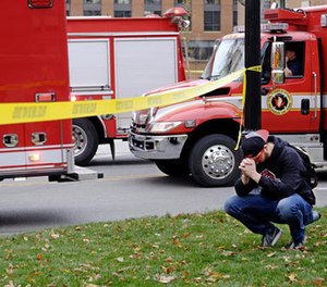 Student Nicholas Flores reacts as police respond to an attack on campus at Ohio State University on Monday, Nov. 28, 2016, in Columbus, Ohio. (Adam Cairns/The Columbus Dispatch via AP)