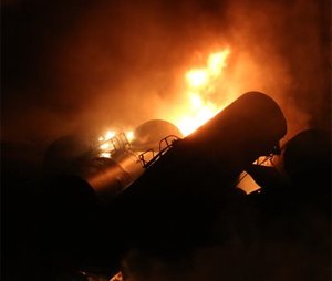 A train carrying more than 100 tankers of crude oil derailed in a snowstorm, sending a fireball into the sky and threatening the water supply of nearby residents.
