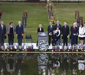 Speakers, including former President Bill Clinton, fourth from left, stand at the opening of ceremonies to commemorate the 20th anniversary of the Oklahoma City bombing.