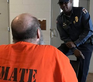 A corrections officer talks with an inmate at the Joseph Harp Correctional Center in Lexington. (Photo/ODOC)