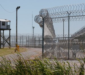This July 10, 2017, file photo shows a tower outside of the razor wire at the Great Plains Correctional Facility in Hinton, Okla.