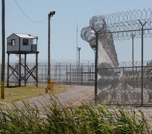 This July 10, 2017, file photo shows a tower outside of the razor wire at the Great Plains Correctional Facility in Hinton, Okla.