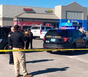 Two victims were shot inside a car and the third was in the parking lot outside a Walmart in Duncan, Okla. (Photo/Sean Murphy/AP)