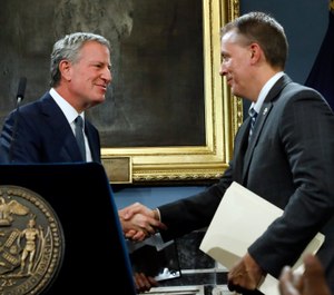 New York Mayor Bill de Blasio, left, shakes hands with incoming New York City Police Commissioner, current Chief of Detectives Dermot Shea. (Photo/Richard Drew/AP)