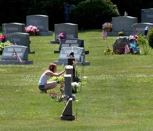 Erika Marble visits the gravesite of Edward Martin III, her fiancé and father of her two children, in Littleton, N.H. The 28-year old died Nov. 30, 2014, from an overdose of the opioid Fentanyl.