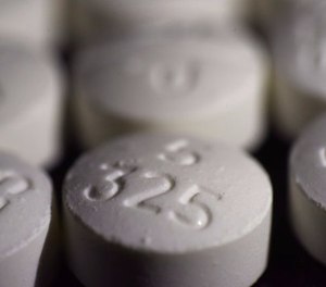 This Tuesday, Aug. 15, 2017 photo shows an arrangement of pills of the opioid oxycodone-acetaminophen in New York. (AP Photo/Patrick Sison)