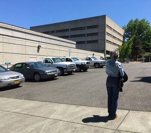 Terry Carlisle looks at the Douglas County Jail in Roseburg, Ore., where she was incarcerated under what she describes as horrific conditions in 2015 for drunken driving.