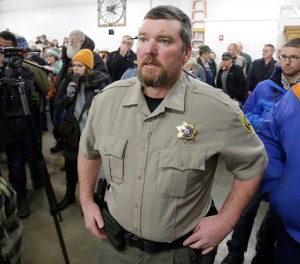 In this Jan. 6, 2016, file photo, Harney County Sheriff David Ward arrives at a community meeting at the Harney County fairgrounds in Burns, Ore. (AP Photo/Rick Bowmer, File)
