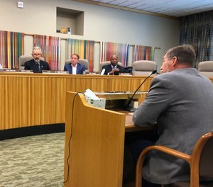 State Sen. Brian Boquist reads a statement on Monday, July 8, 2019, to the Senate special committee on conduct in Salem, Ore. (AP Photo/Andrew Selsky)